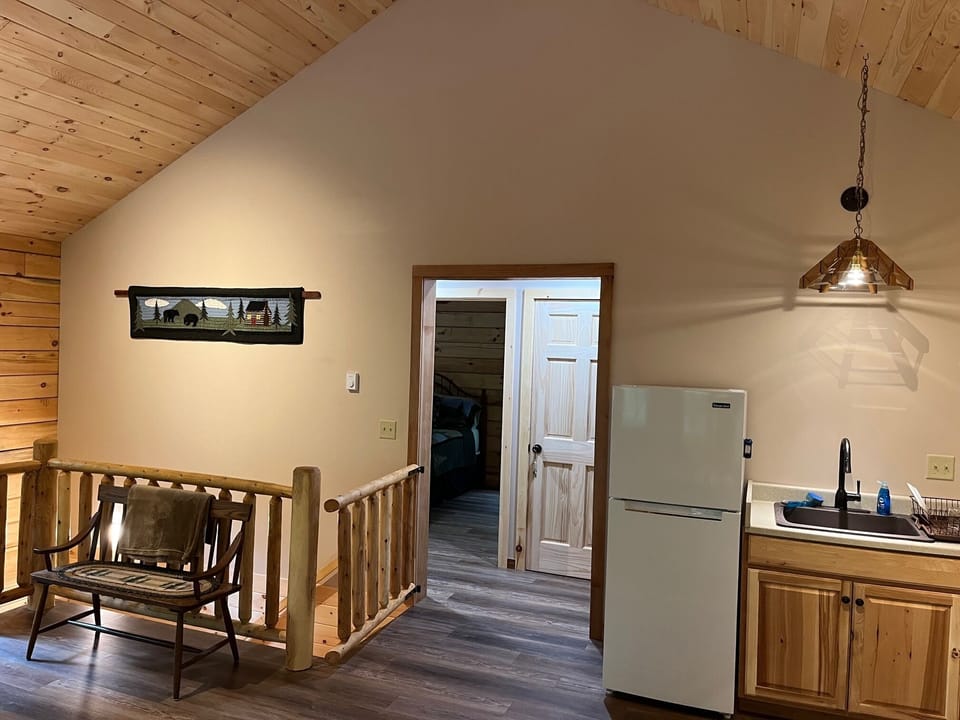 Hallway to Master bedroom and 2nd bathroom.  Stairway downstairs w/gate.