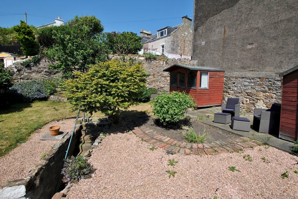 The tiered garden offers a sheltered space to enjoy the sunshine