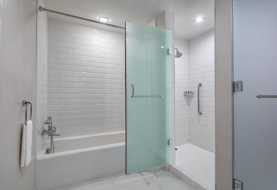 Rinse off in a sleek walk-in shower and tub combo.