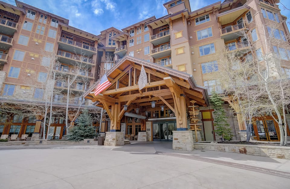 The front portico offers covered entry to the lobby and valet.