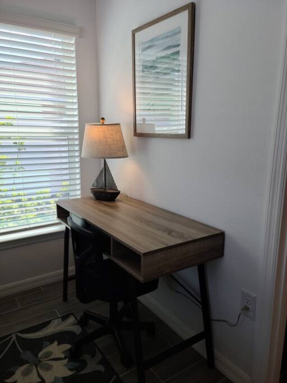 Workspace in primary bedroom gets plenty of light