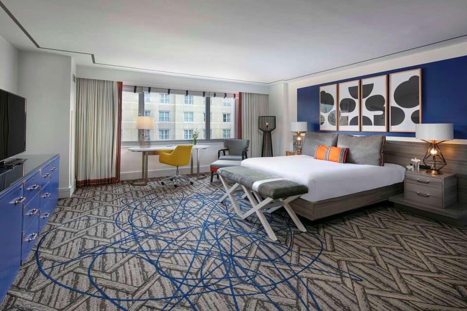 Unwind in a spacious king room with calming city views.