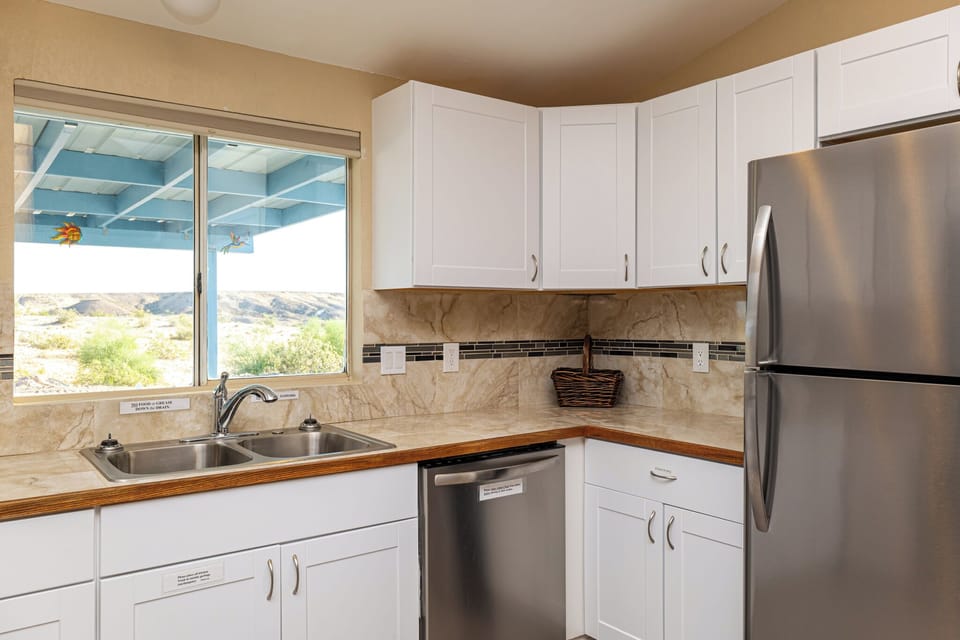 New appliances, including dishwasher and full-sized refrigerator. 