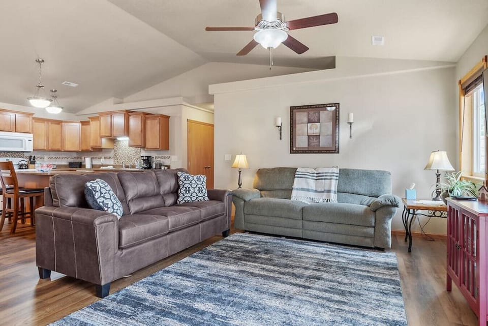 The living area is a cozy haven, featuring a plush sofa,  equipped with other thoughtful amenities to enhance your stay.....