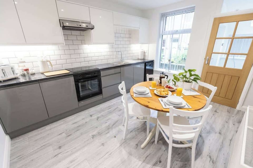 Bright and spacious kitchen leading onto a small terrace