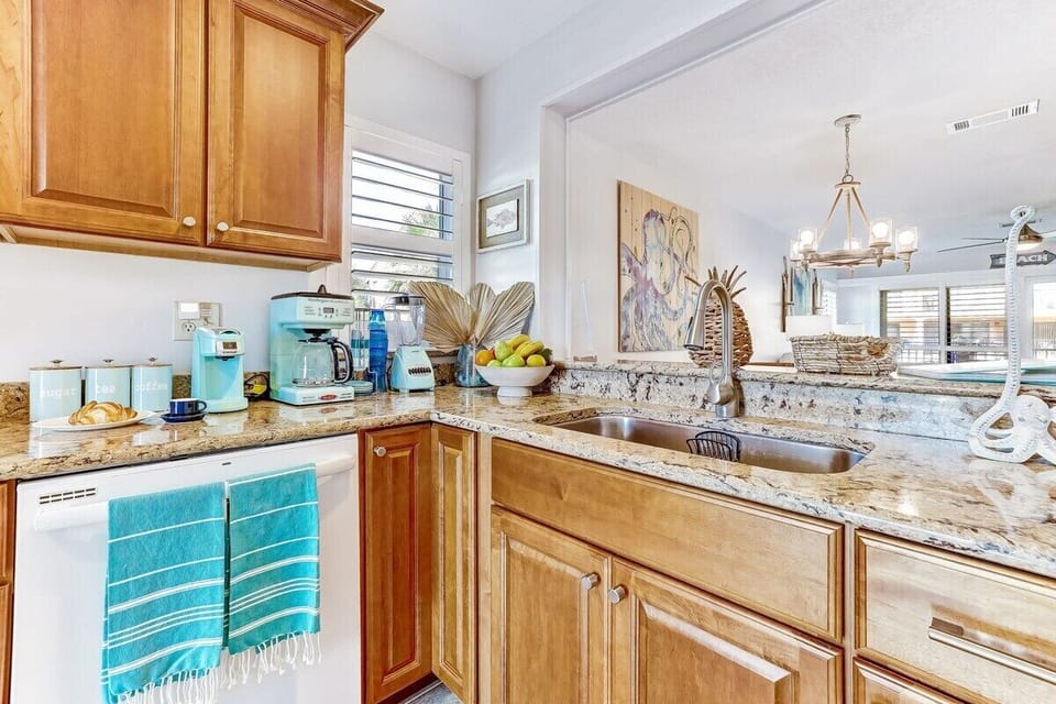 Modern kitchen appliances that reflect the beautiful color of our beach's waves.