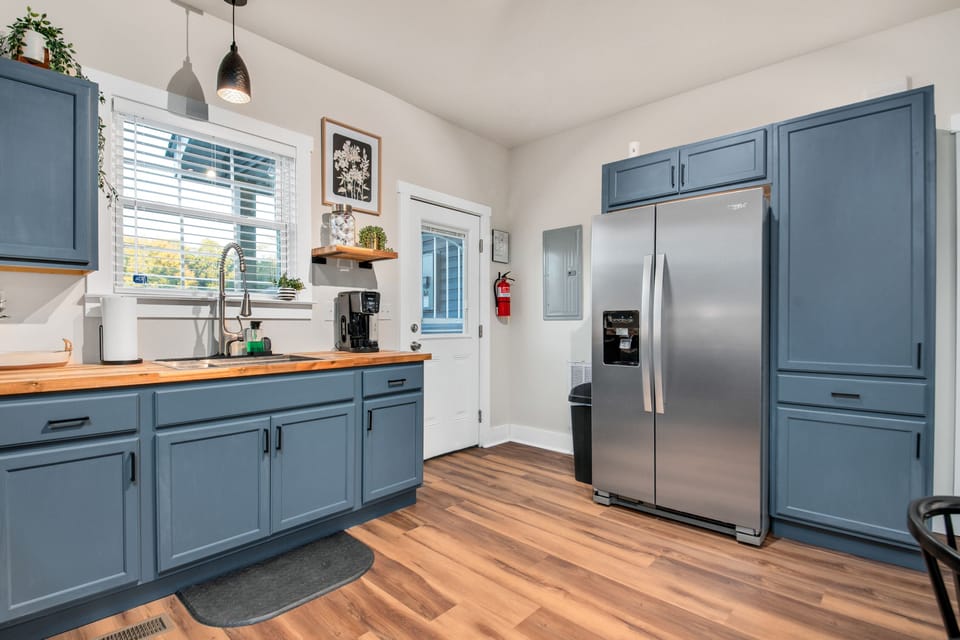 Large refrigerator. Toast and ninja blender in pantry
