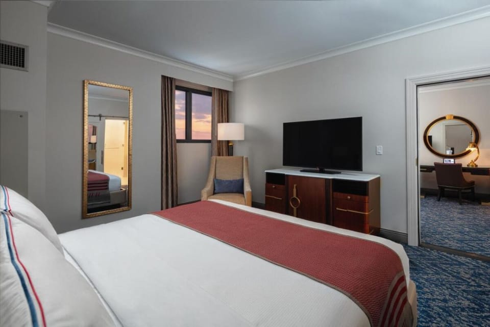 Settle in as sunset light warms the room and bed.