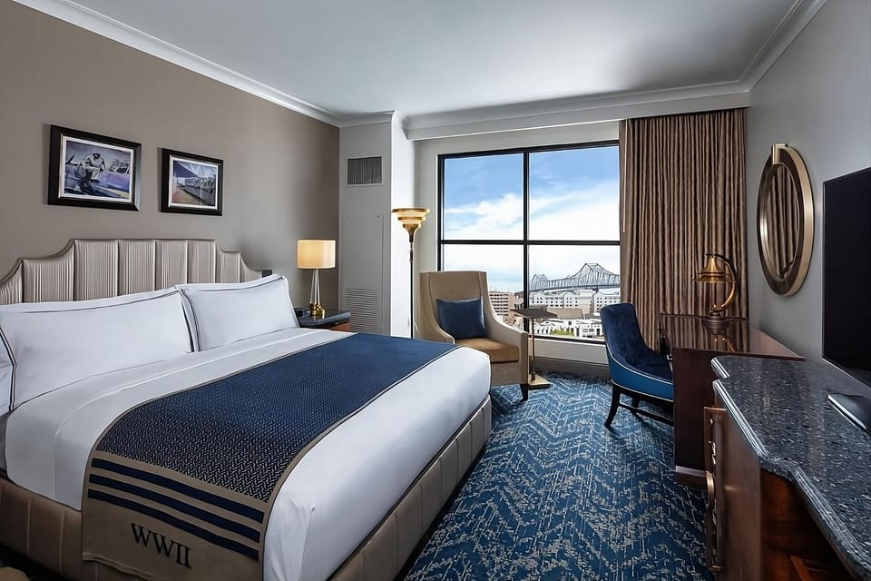 Unwind in plush king comfort with sweeping skyline views.