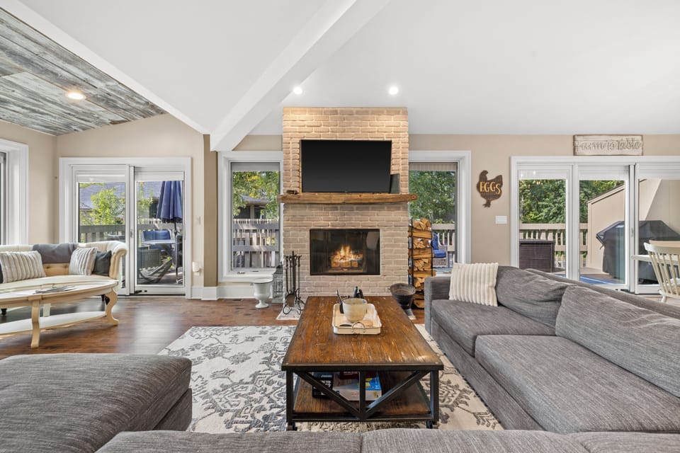 Living room with fireplace, tv, board games