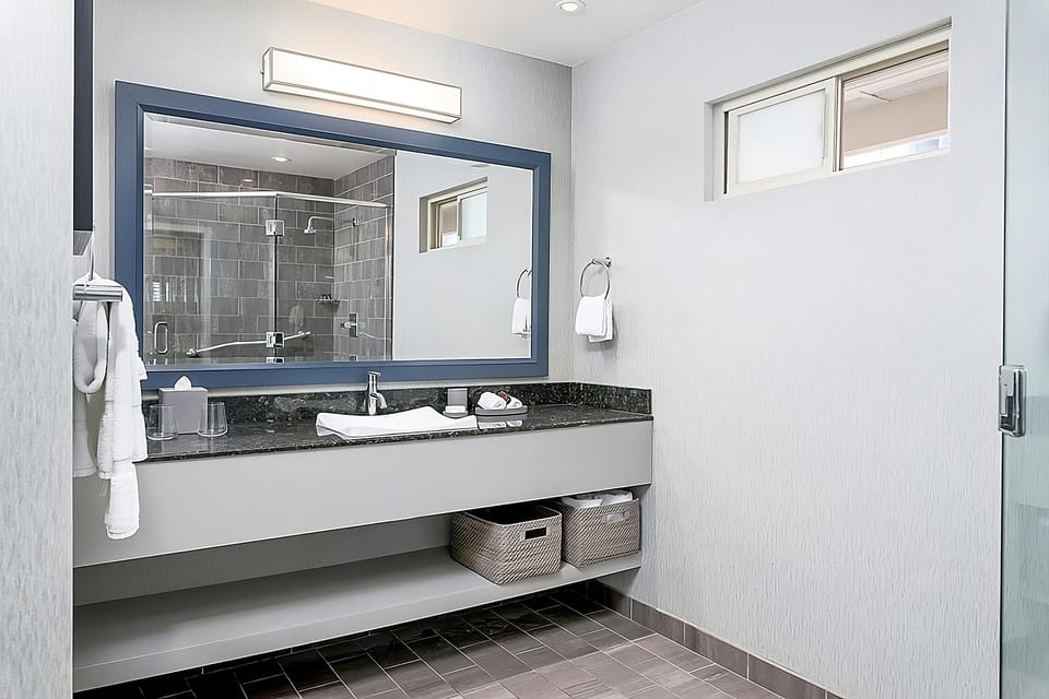 Get ready with generous counter space and fresh towels.
