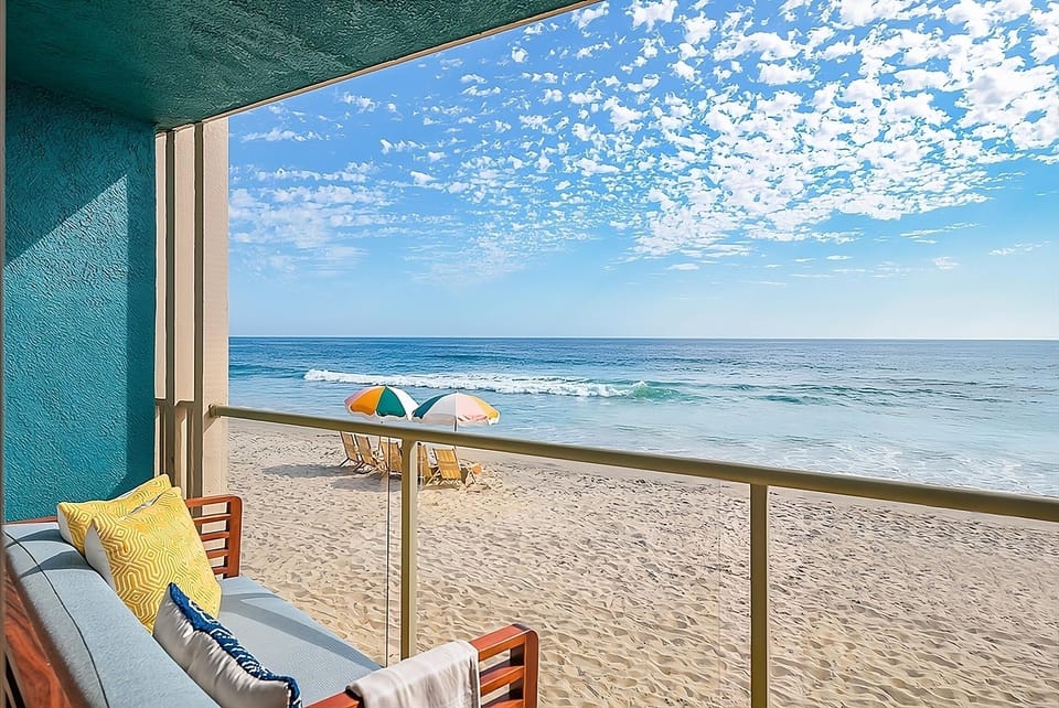 Sip morning coffee while waves roll in below.