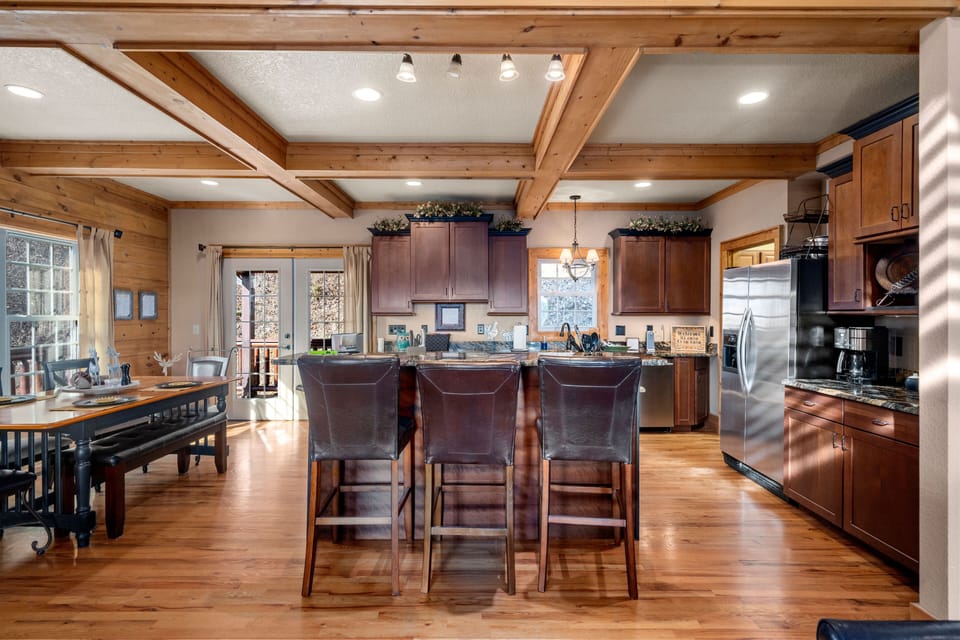 Open kitchen with dining and island seating