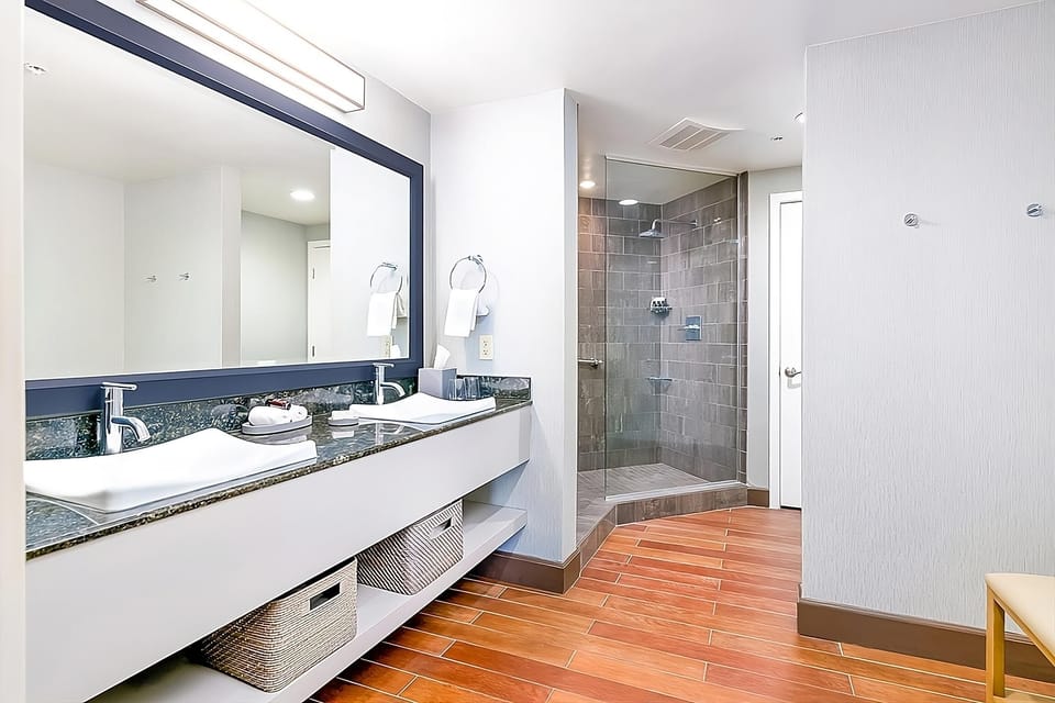 Refresh with double vanity space and a sleek walk-in shower.