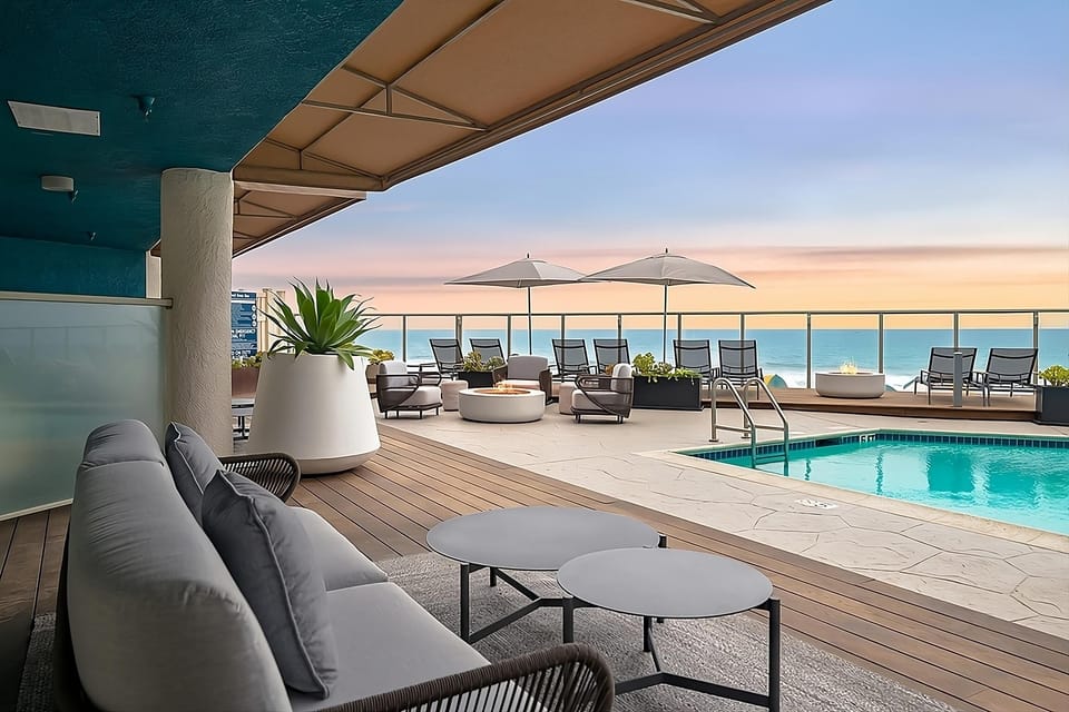 Soak in oceanfront pool views and sunset lounge serenity.