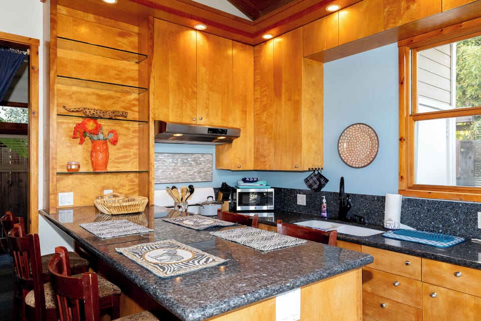 Back house well equipped kitchen and granite counter eating area
