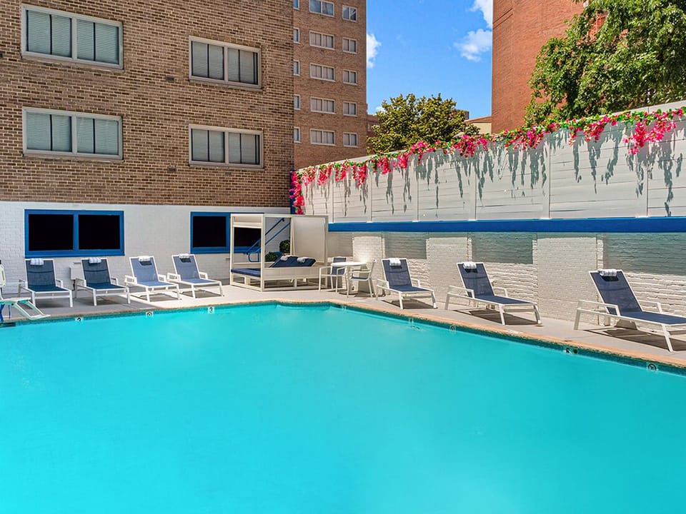 Soak up sunshine poolside in a public onsite pool.