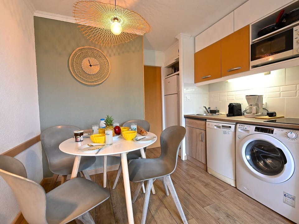 Furniture, Property, Cabinetry, Table, Chair, Wood, Kitchen Appliance, Lighting, Interior Design, Kitchen Stove