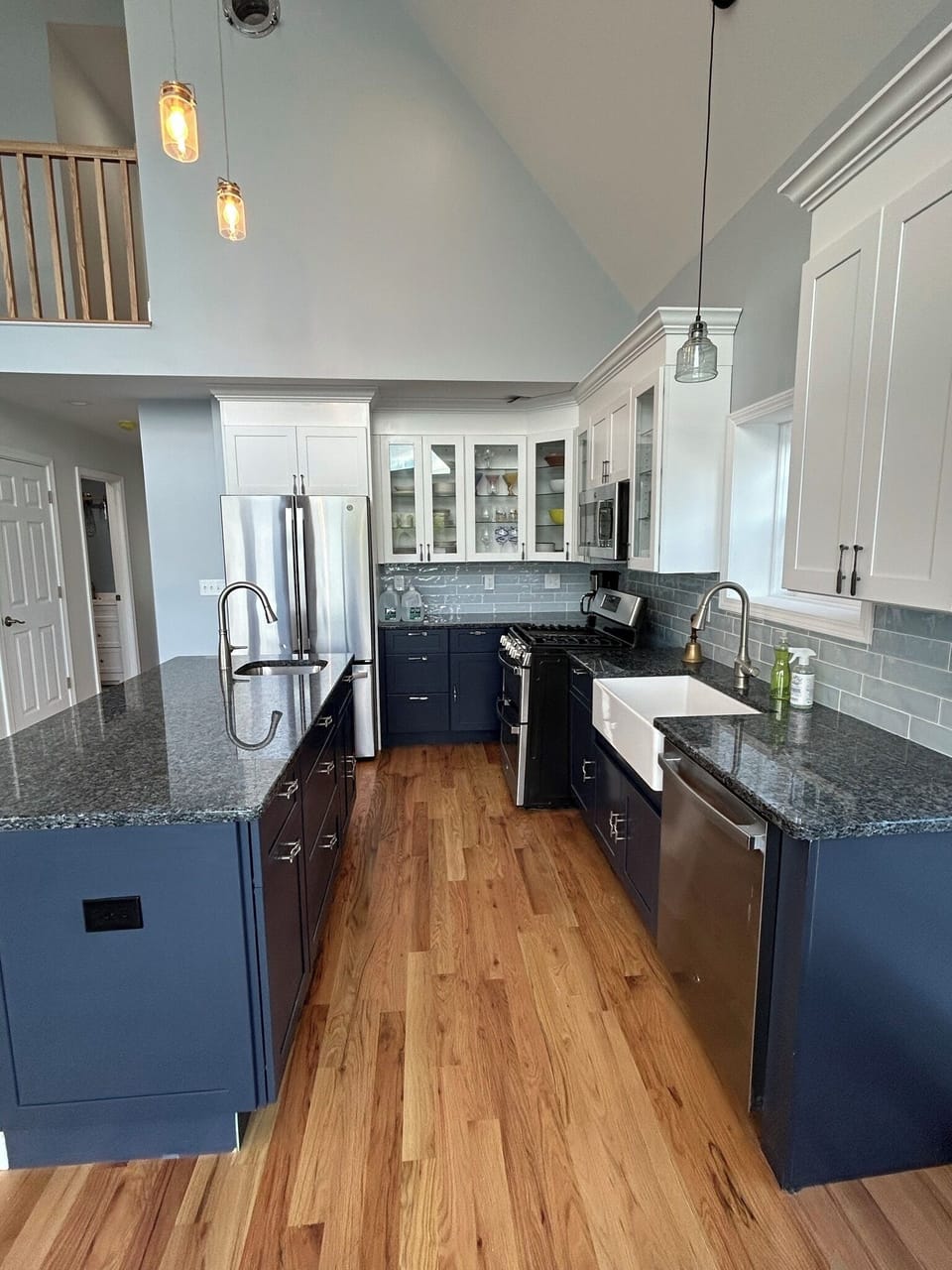 Chef's kitchen with stainless appliances, farm sink, bar sink, double oven. 