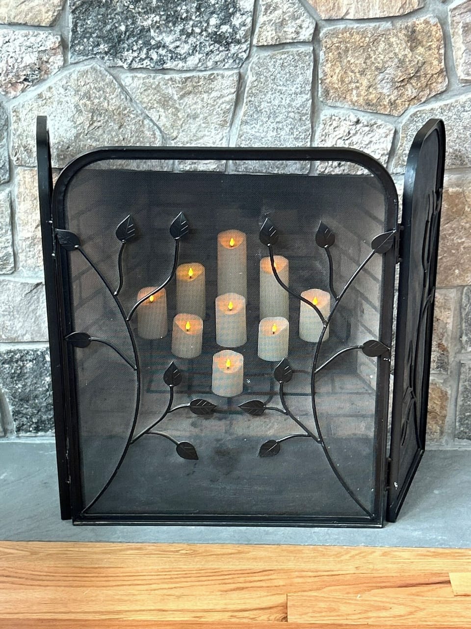 Candleabra in fieldstone fireplace sets a charming mood in the evenings.