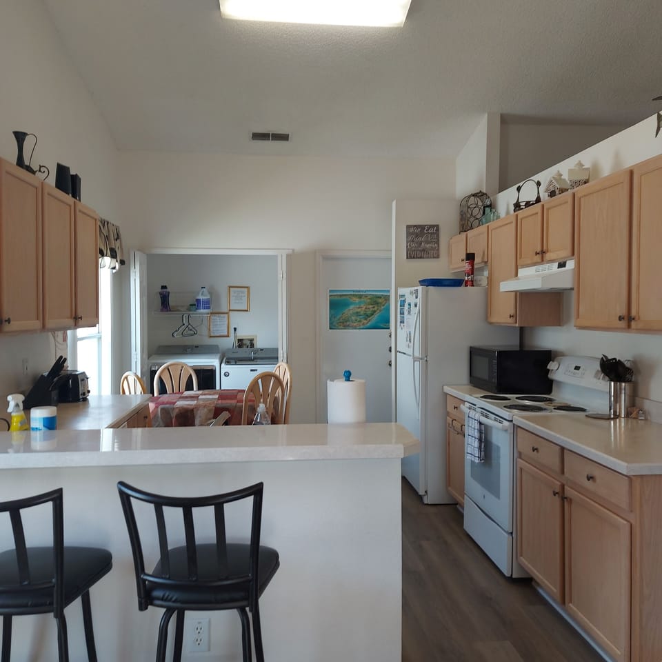 Kitchen with laundry closet and access to Garage