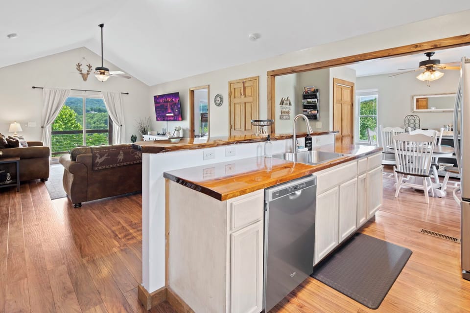 Fully stocked kitchen with slow cooker, seasoning, pots & pans, tupperware, and all of the extras