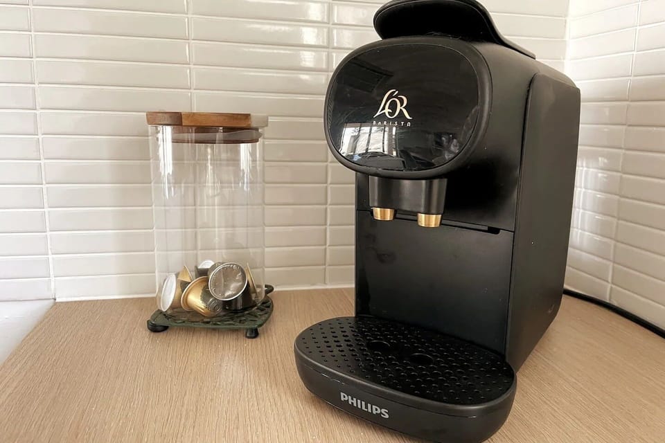 Nespresso coffee pod macines in each unit.