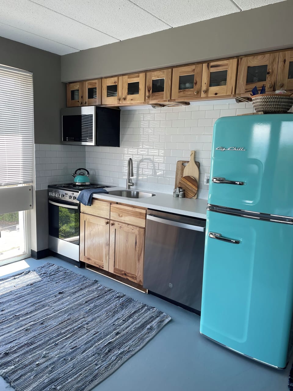 Newly remodeled kitchen w/ stainless steel appliances and Big Chill retro fridge