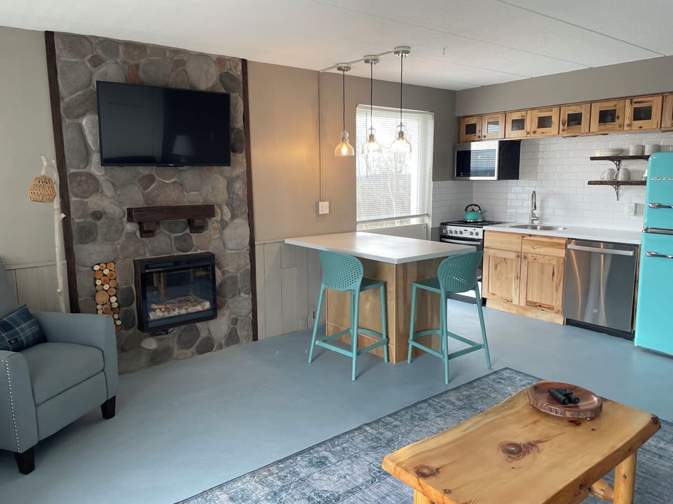 Vintage lake charm with Island dining. End unit with window is light filled!