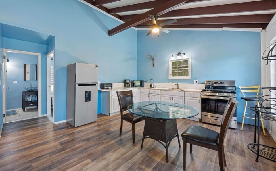 The kitchen has newer appliances and is equipped for basic cooking. The