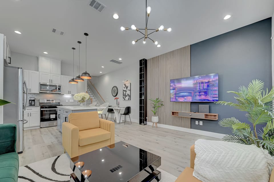 Immaculate and spacious living room, complete w/ a 65" smart TV and PlayStation