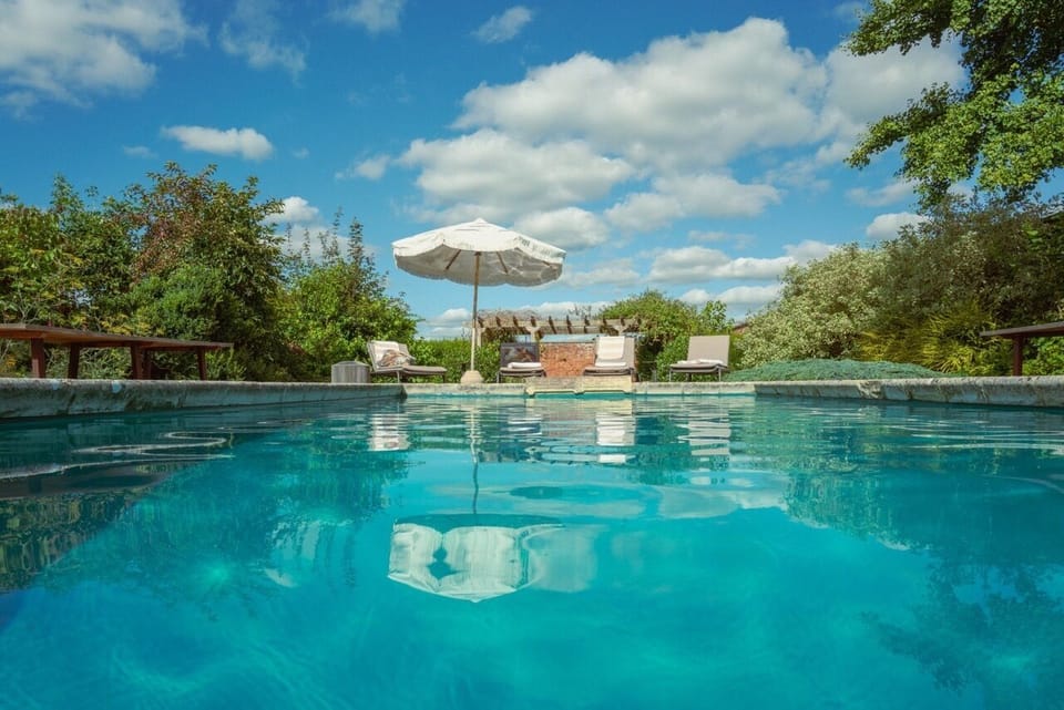 Heated outdoor pool housed in wall garden
