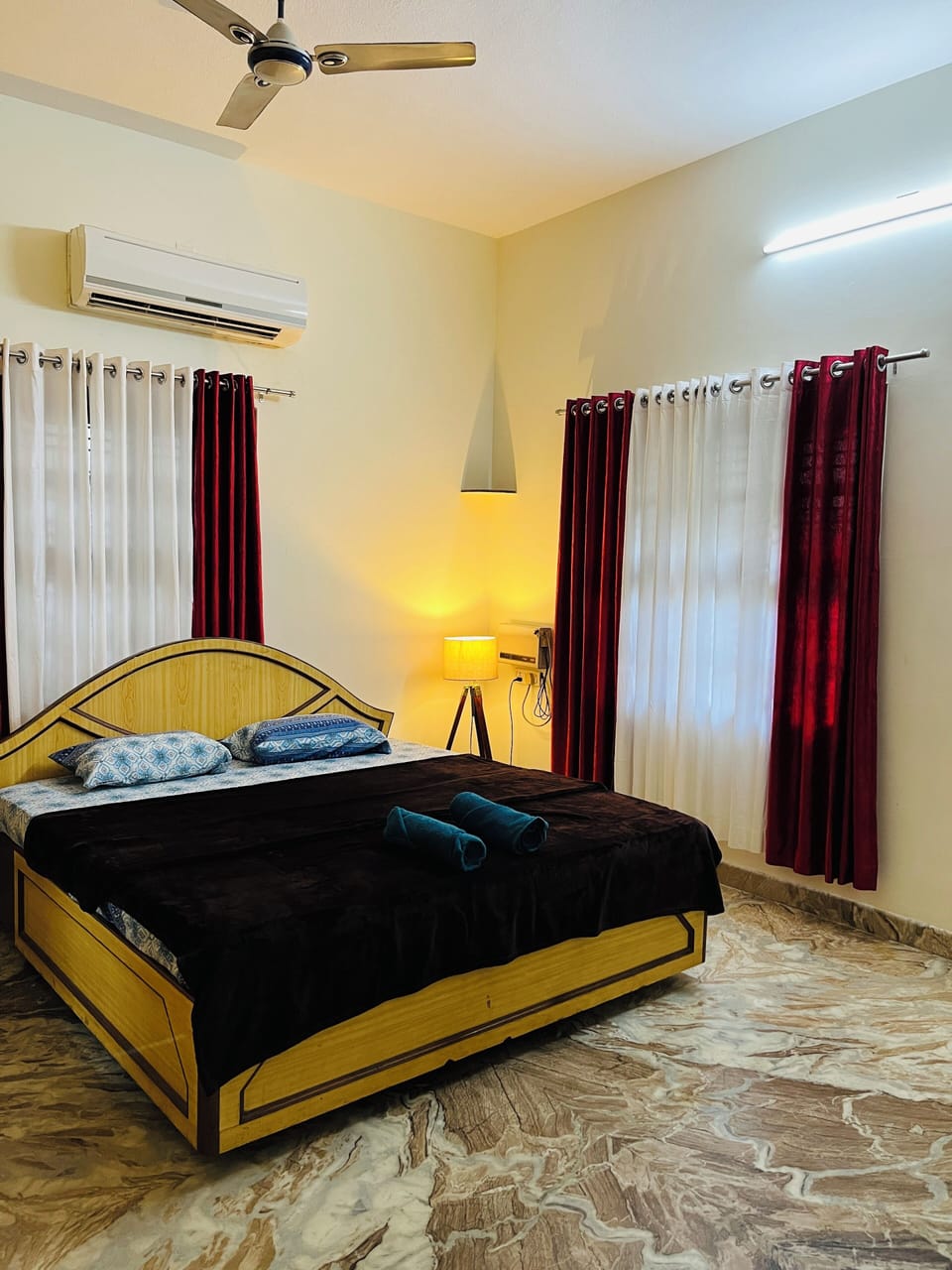 Bedroom with Air Conditioner and attached Bathroom
