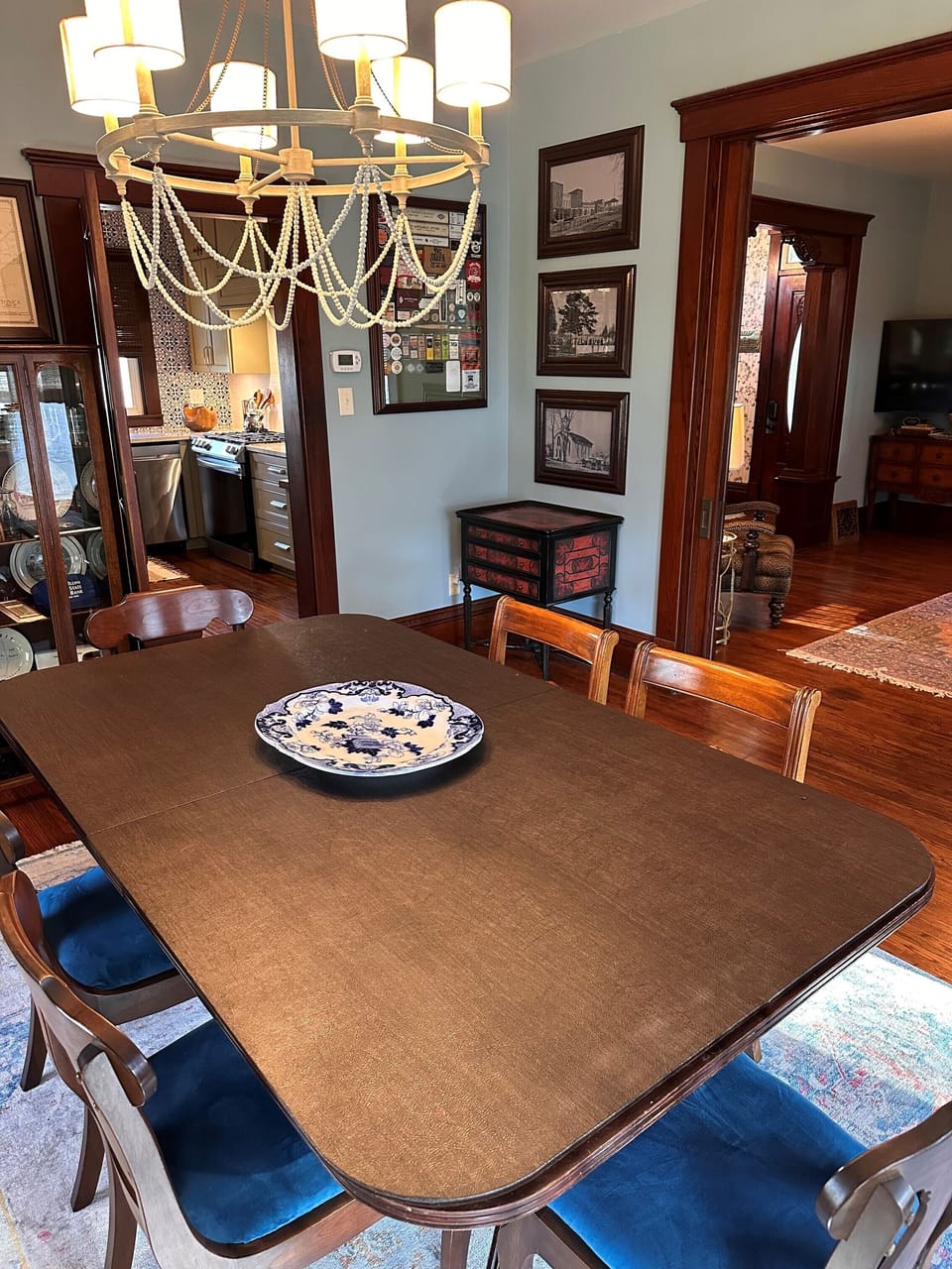 Dining Room Views into Kitchen and Living Room Areas
