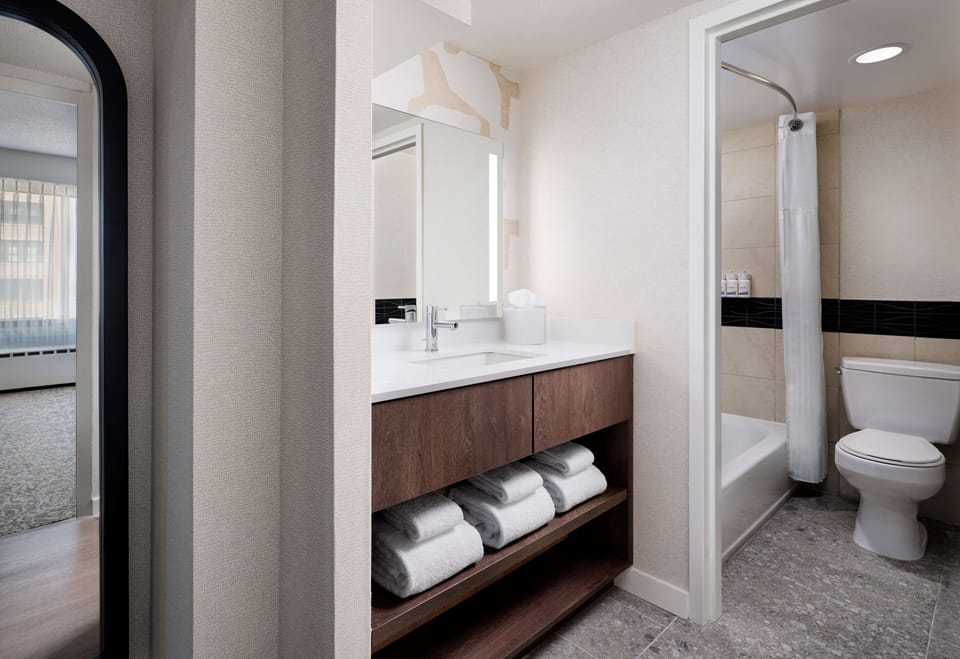 Refresh easily with a spacious vanity and neatly stocked towels.