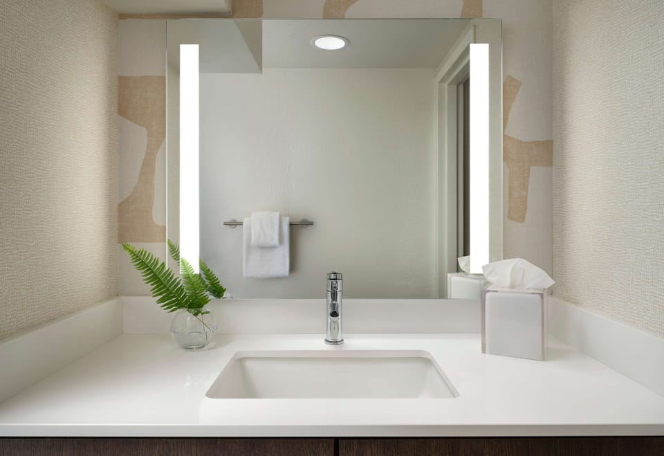 Get ready in style with a bright mirror and clean counters.