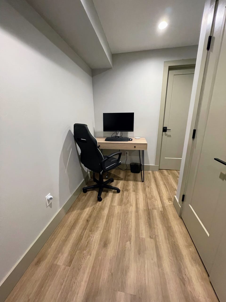 Office area with a new large 4K 27" monitor USB-C, keyboard, mouse, camera