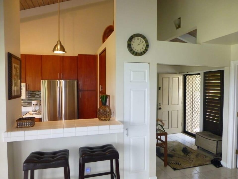 Open Kitchen With Breakfast Bar Adjacent To Dining Area & Lanai