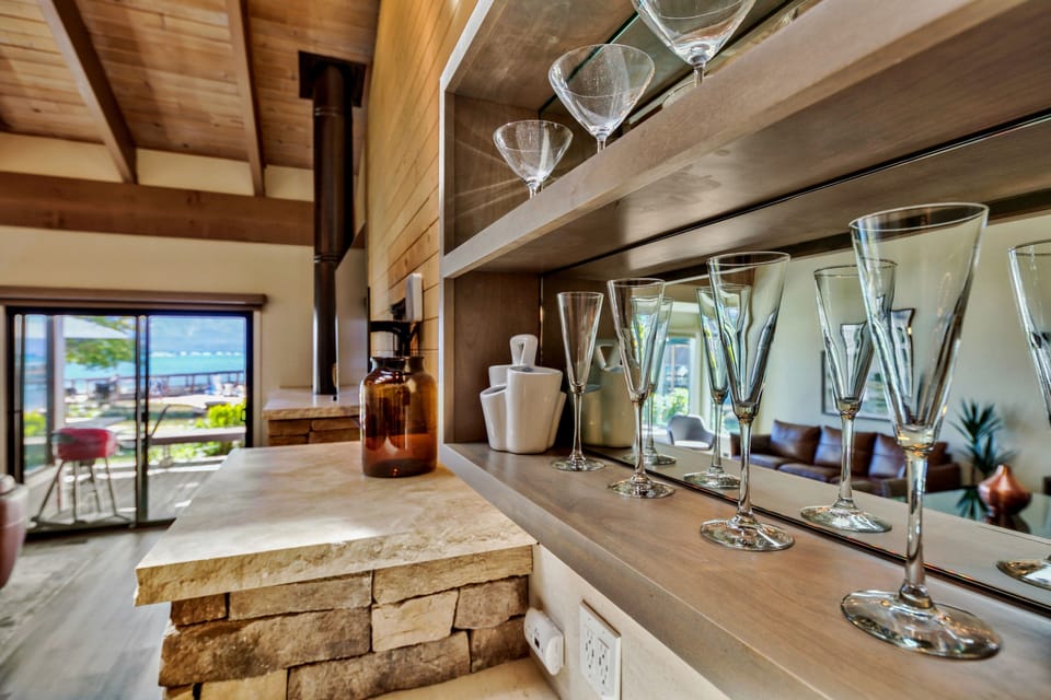 Celebrate special moments in your beautifully appointed kitchen, where elegant glassware awaits your favorite wines and stunning ocean views create the perfect backdrop.