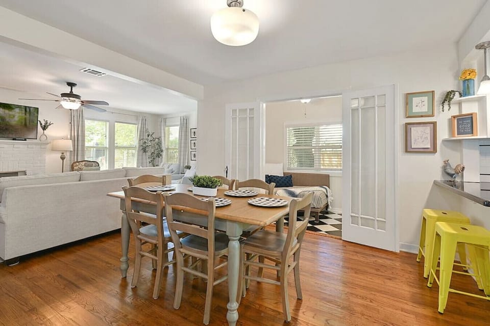 Dining room situated between the kitchen and living room.