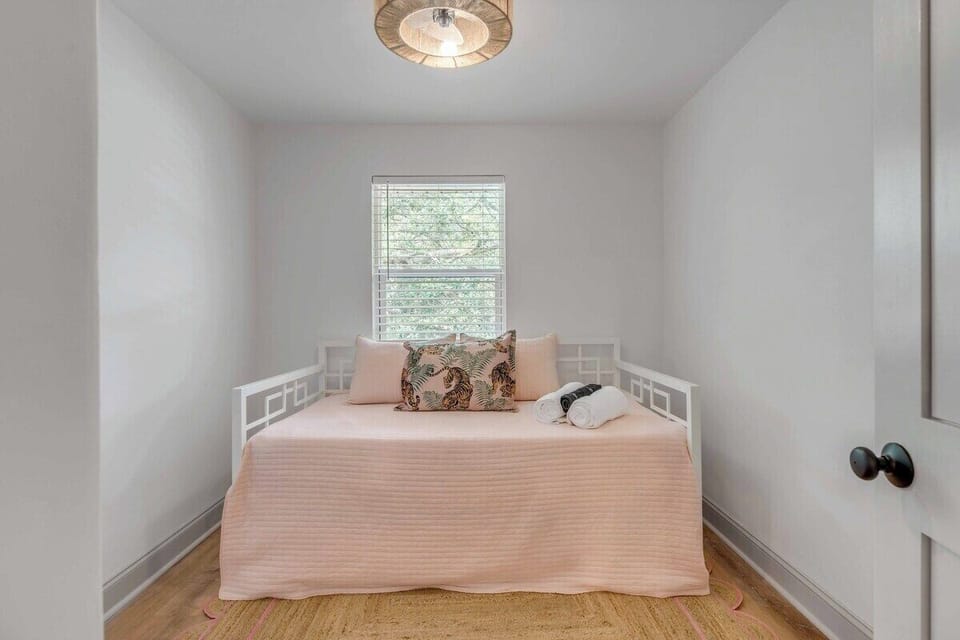 Bedroom 3's twin + twin trundle that pulls out for sleeping guests 5 + 6.