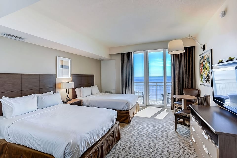 Breathe in ocean air as sunlight pours into your room.
