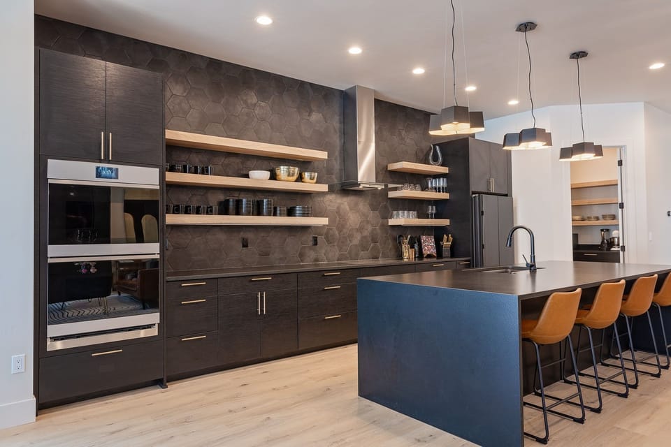 Kitchen- Fully stocked with a convenient prep room just off the main kitchen.