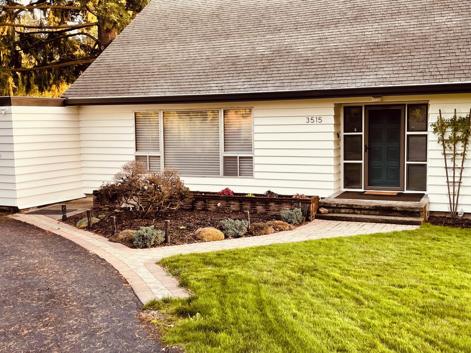 Walkway to front porch from half-circle drive.