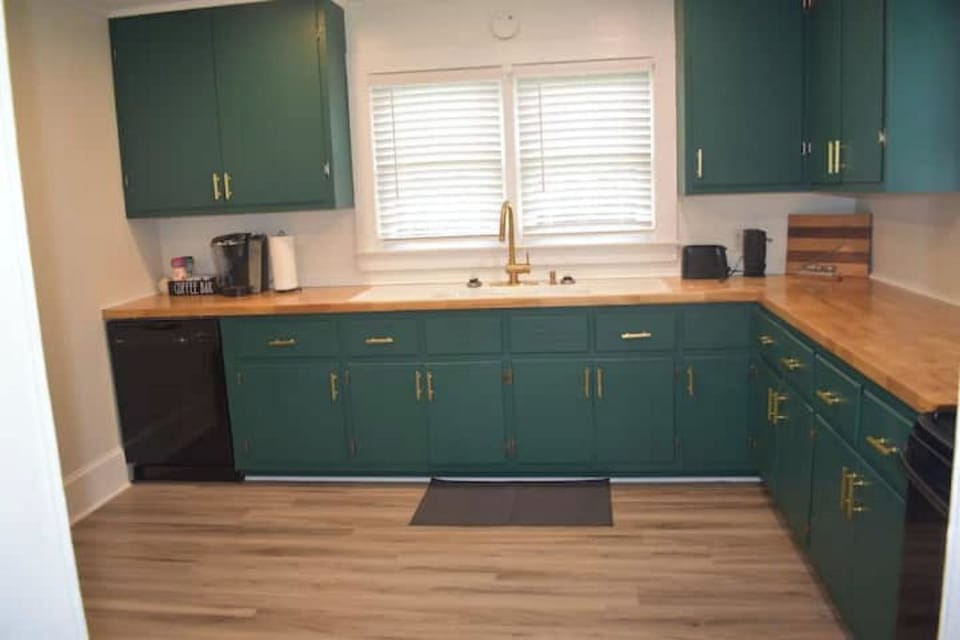 Farm kitchen sink and plenty of cabinet space filled with whatever you need