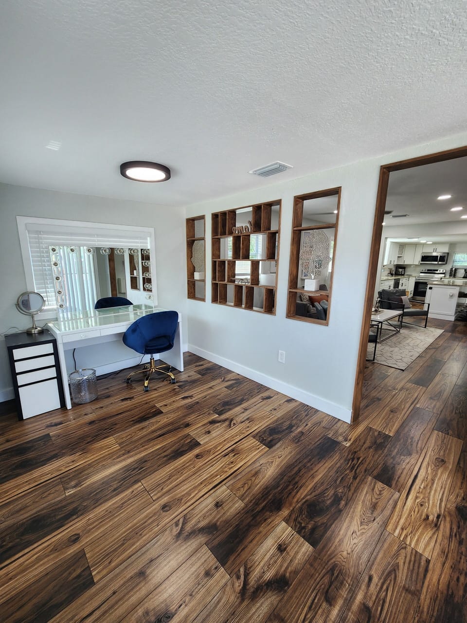 Bright front room with mirror vanity and table, perfect for getting ready.
