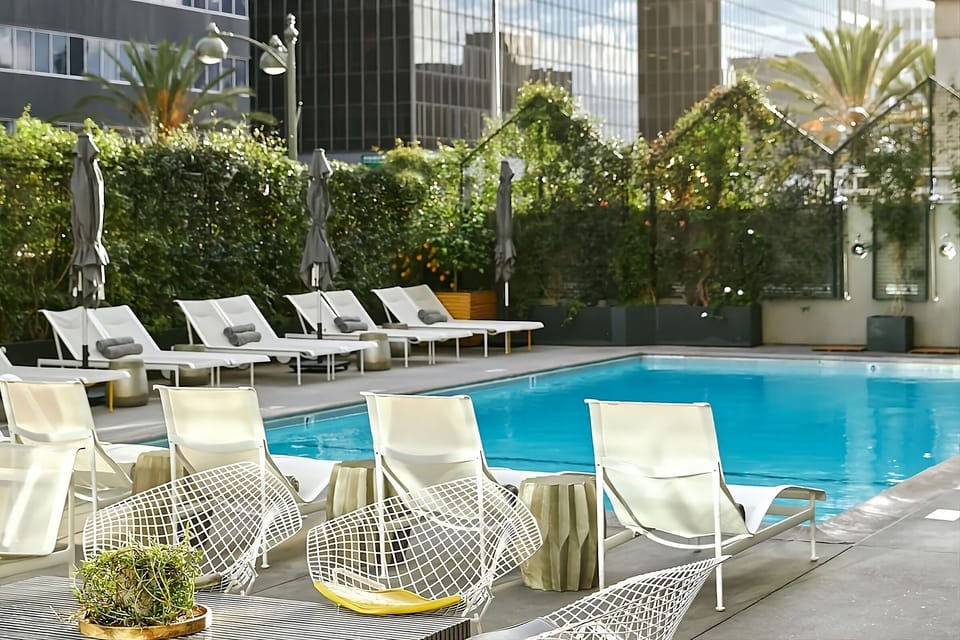 Soak up the sun on loungers beside the sparkling pool.