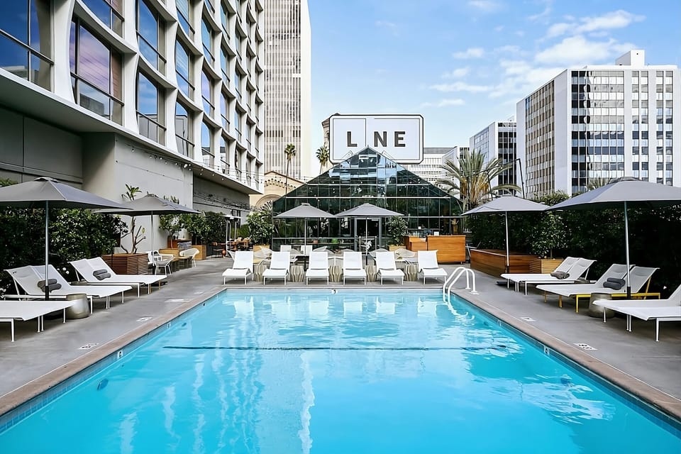 Dive into a resort-style pool framed by downtown energy.