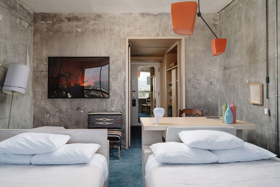 Spread out with two beds in a stylish concrete retreat.