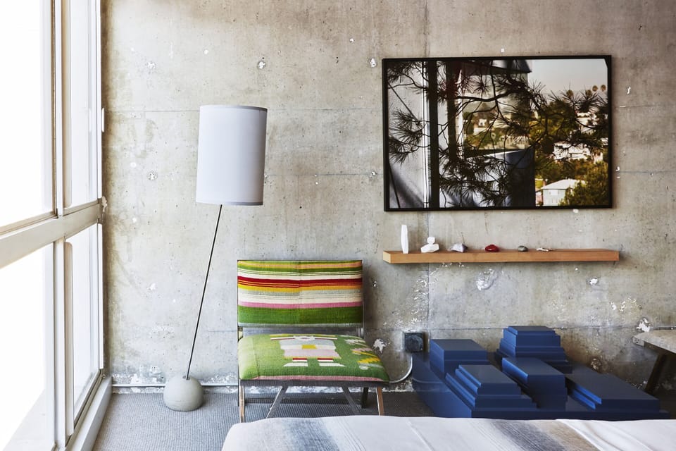 Unwind beside bright windows with artful minimalist styling.
